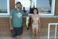 Father and daughter holding a fish caught on Lake Simcoe