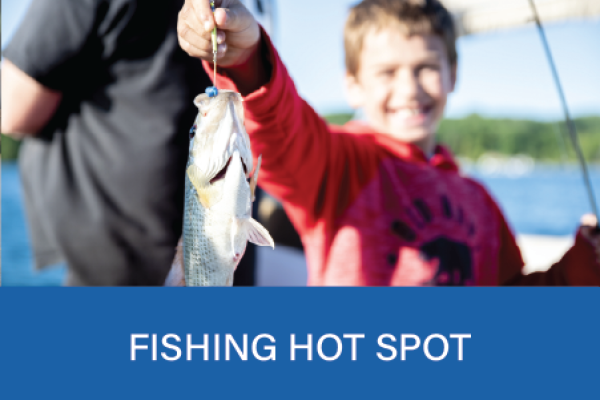 young boy holding a fish on a lure at Lake Simcoe Marine